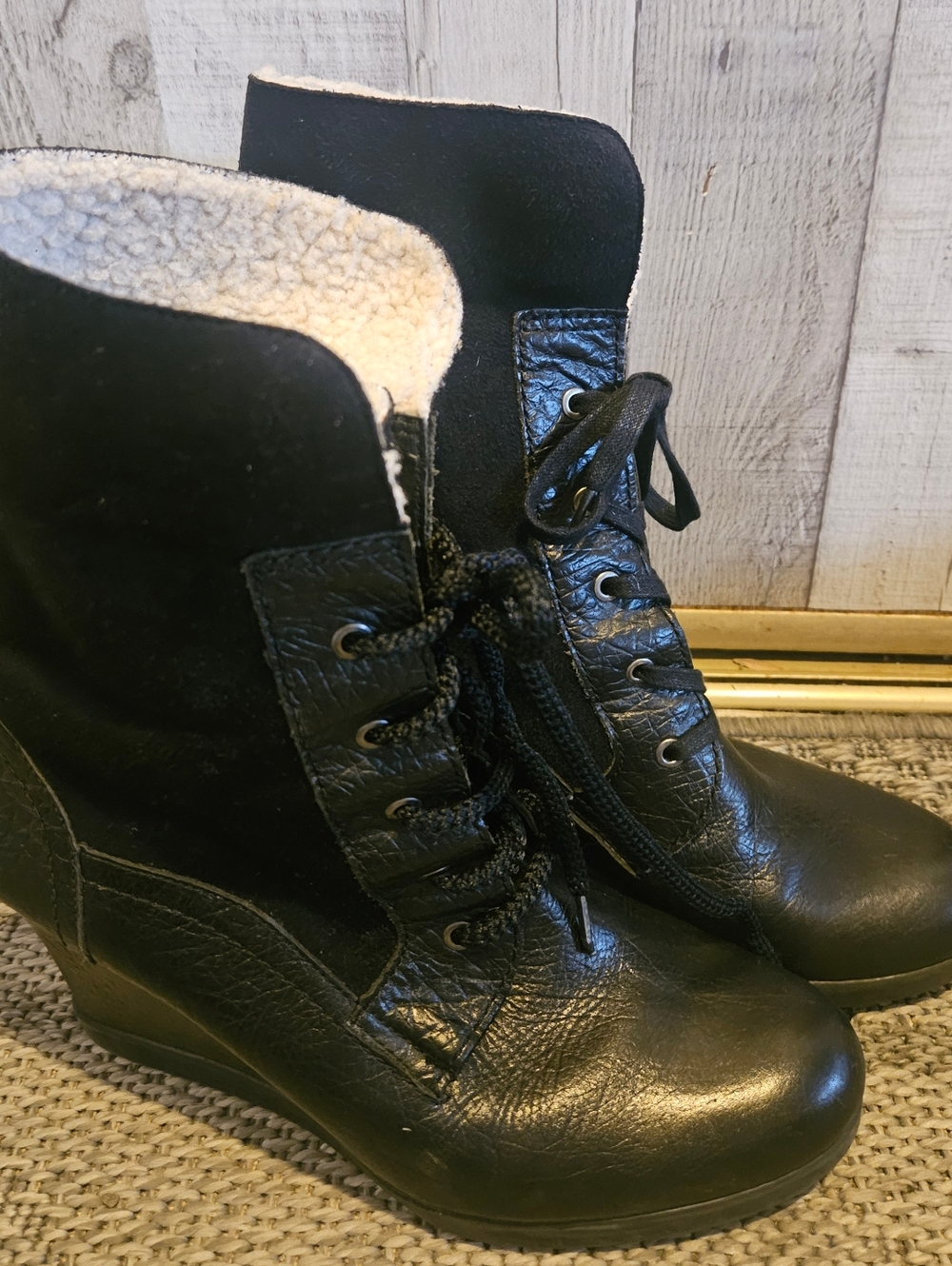 Franco Sarto Waverly black leather wedge boots.